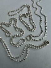 Load image into Gallery viewer, Two silver-toned metal chains, one beaded ball chain and one curb chain, arranged on a light gray background.