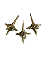 Load image into Gallery viewer, Brass Strange News Charm
