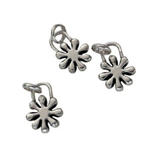 Load image into Gallery viewer, Pair of silver flower-shaped earrings on a white background

