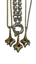 Load image into Gallery viewer, three star charms with piercings and garnet gemstones on various charm necklaces
